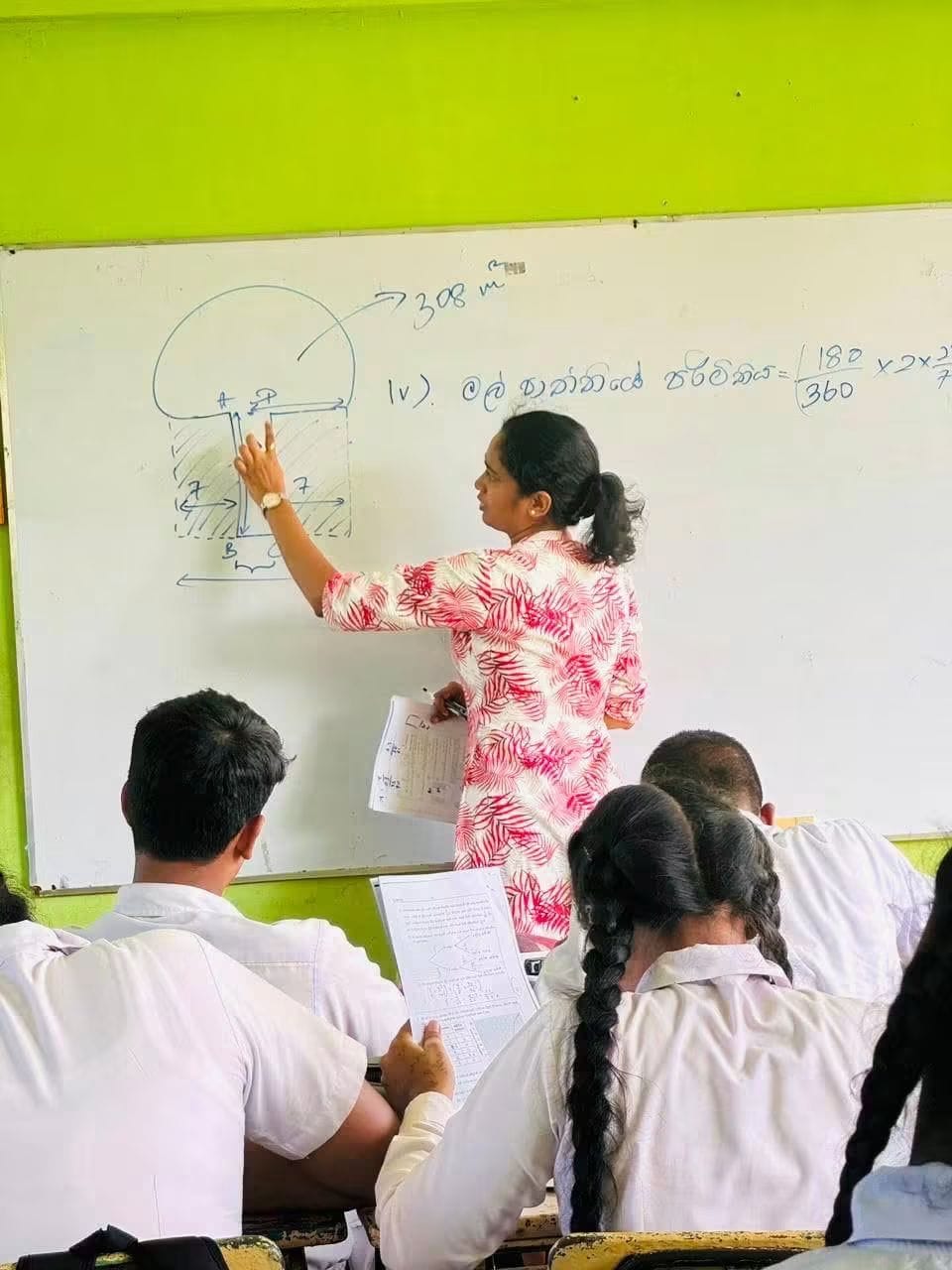 Volunteer teaching an O/L mathematics seminar